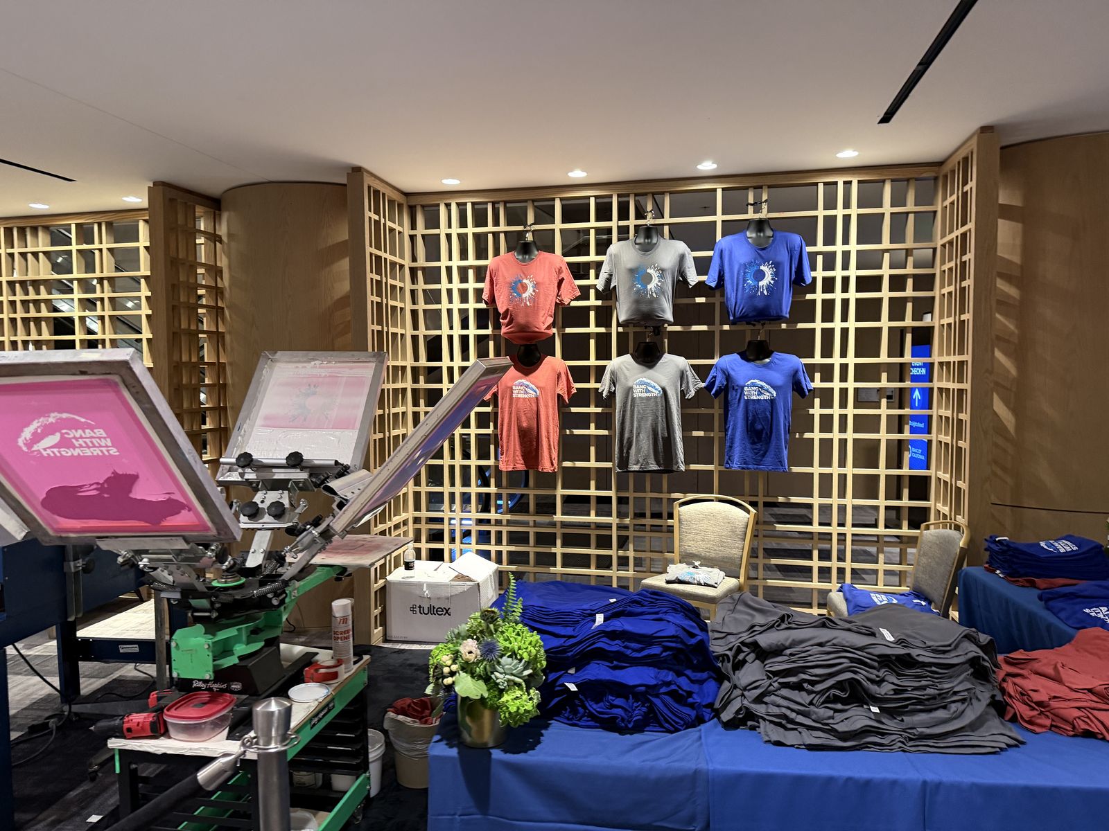 Merch Troop live screen-printing station running at a Minneapolis event